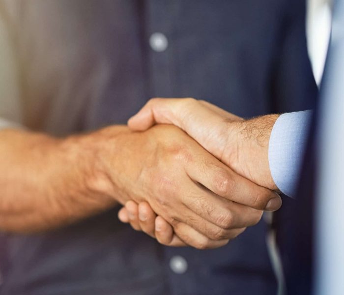 Close up of businessmen shaking hands